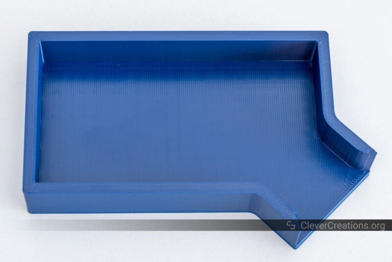 A blue ABS 3D print of a parts tray