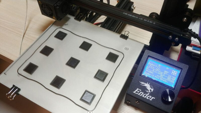 An Ender 3 printer that has completed a first-layer calibration test
