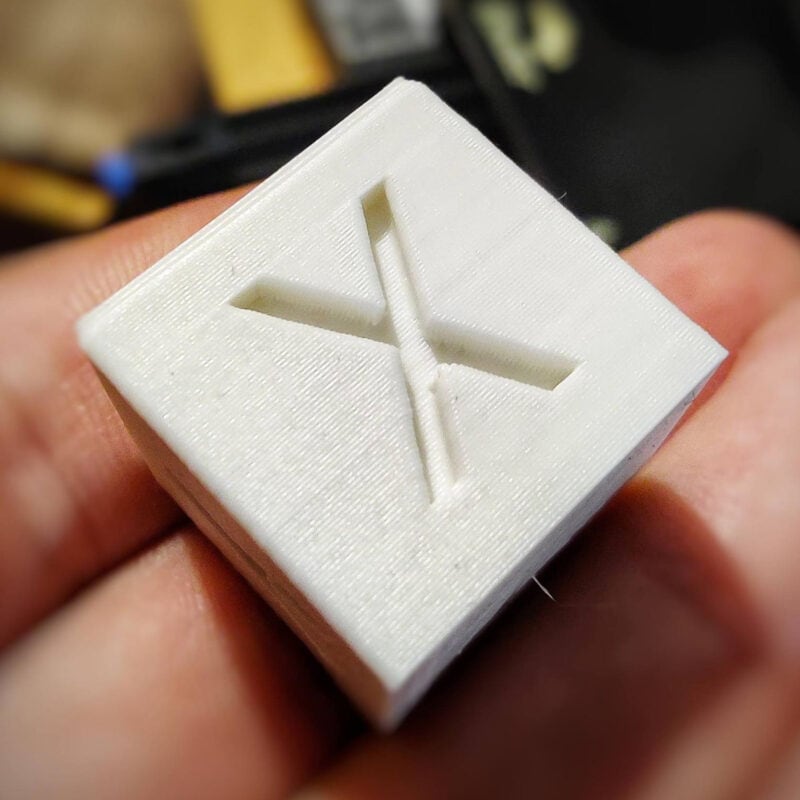 A white calibration cube with a flawless smooth finish