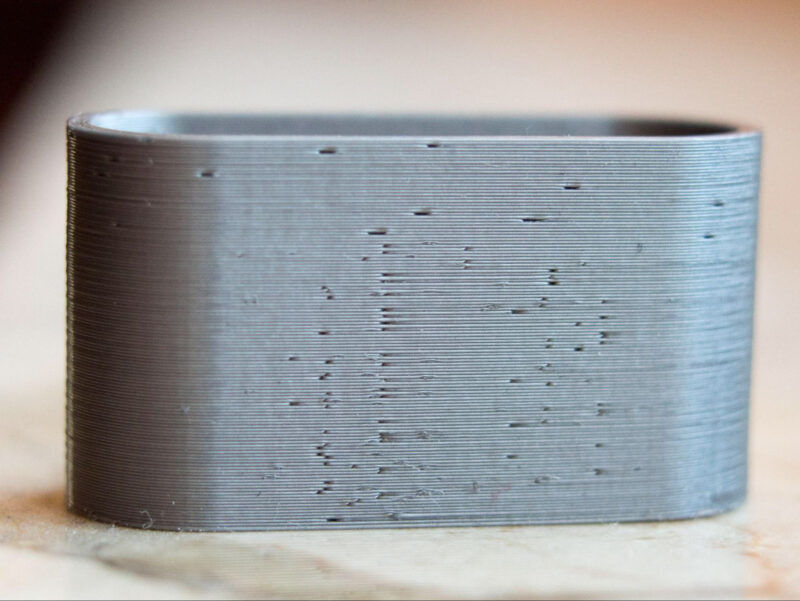 A close-up of small holes in 3D printed layers