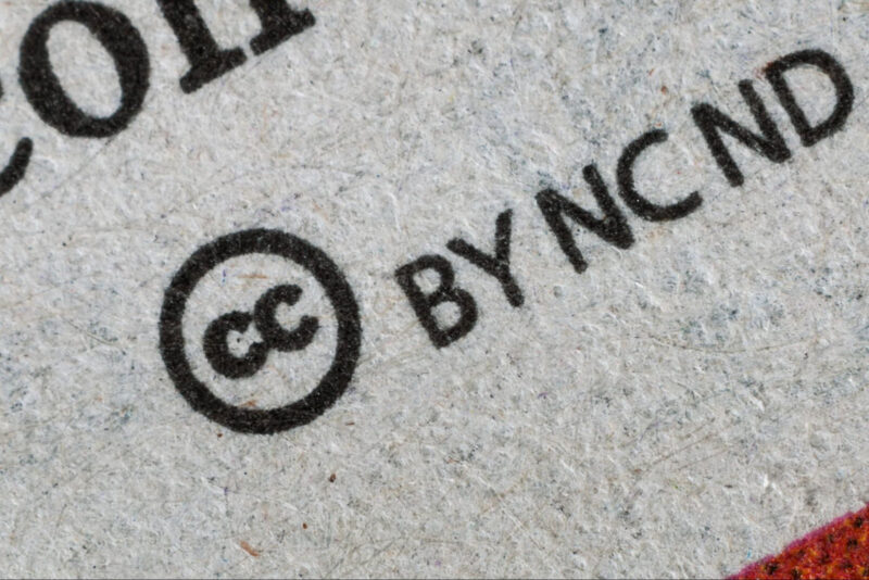 A close-up of an imprinted Creative Commons - BY-NC-ND logo