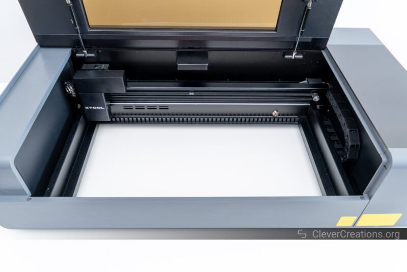 An overview of the work area of the xTool P2 CO laser cutter with bottom tray removed