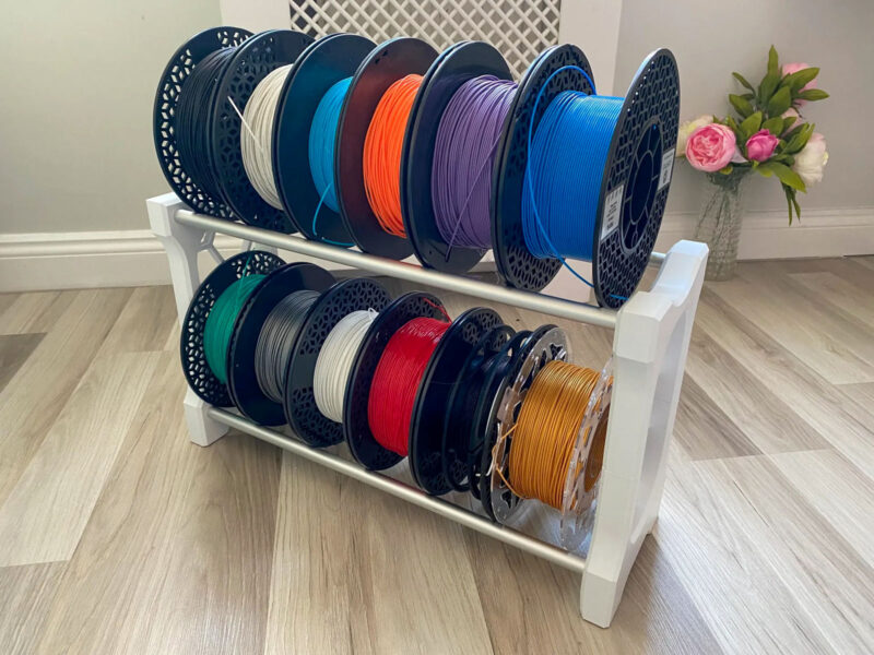 A rack with ABS filament alternative options in various colors.