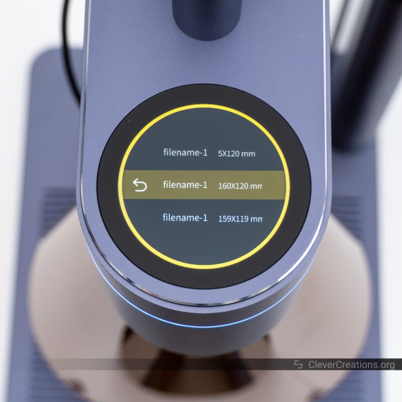 The user interface of the LaserPecker 4 with the file selection screen visible.