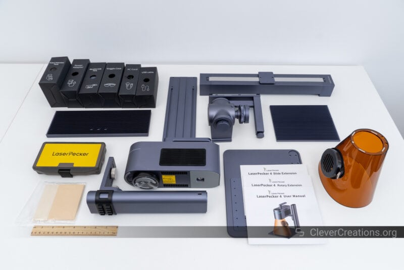 The components of the LaserPecker 4 laser engraver laid out during unboxing.