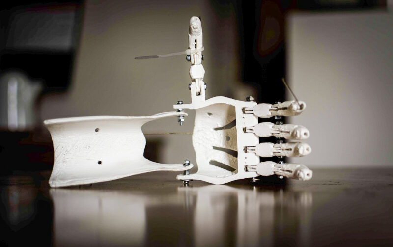 A 3D-printed prosthetic made with white Polycarbonate material.