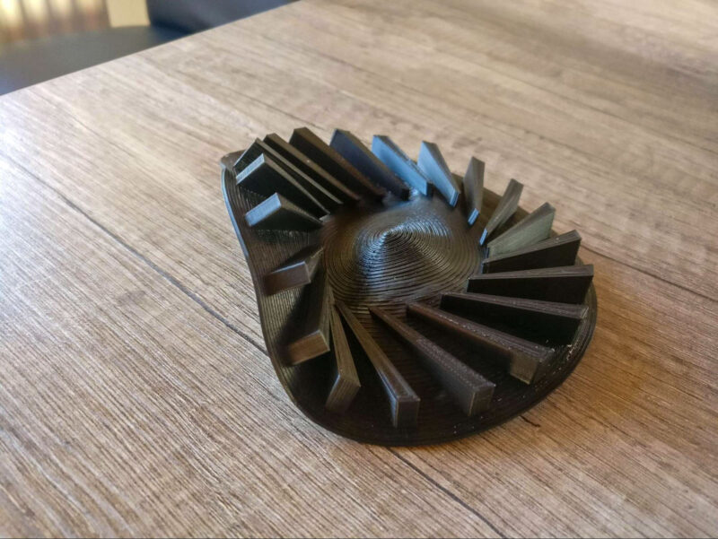 A deformed dishwasher component made of PLA filament material.
