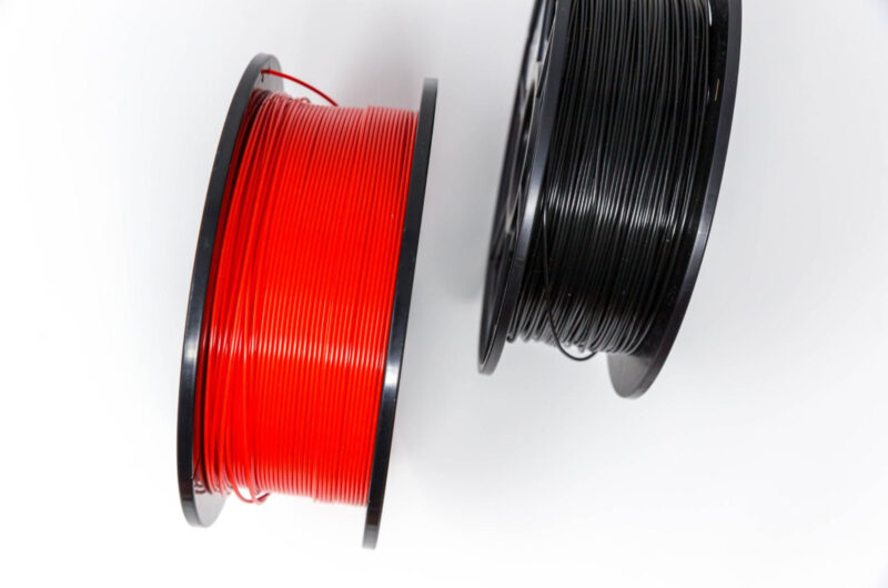 Two spools of PLA 3D printing filament shown from above.