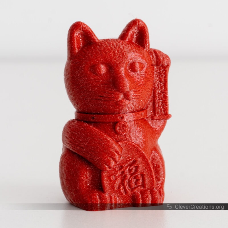 A red glitter 3D printed cat