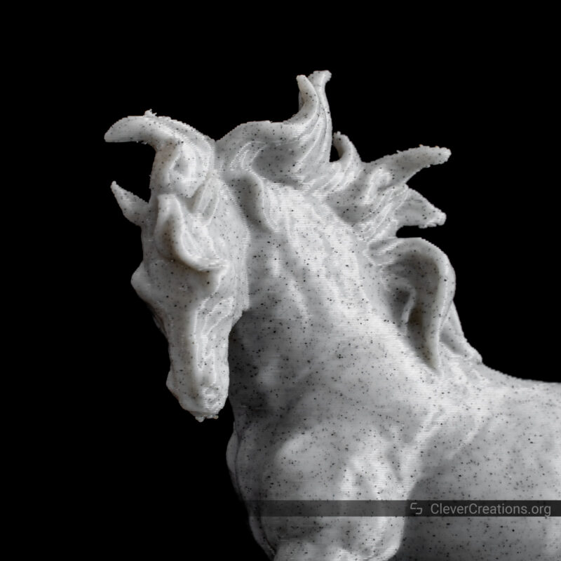 A 3D printed white marble horse in front of a black background.