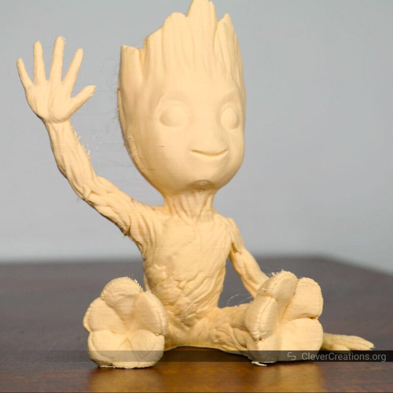 A 'Groot' with minor stringing defects on a table.