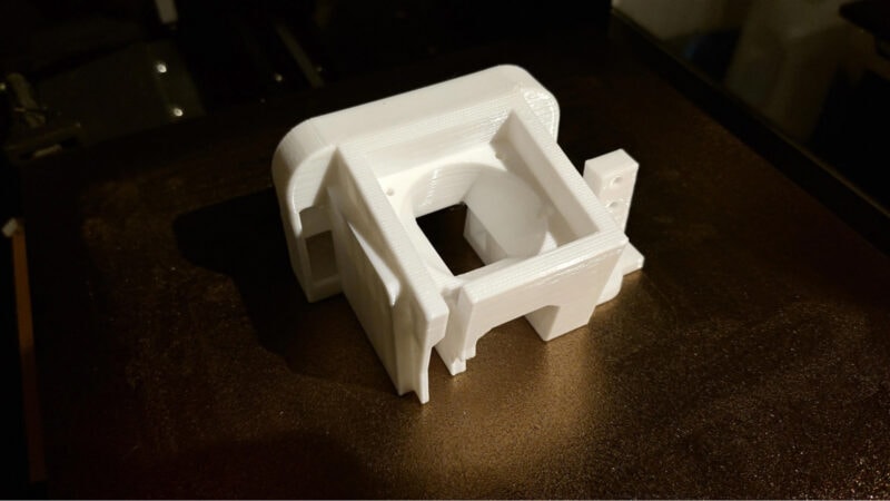 A white functional Polycarbonate object made with a 3D printer.