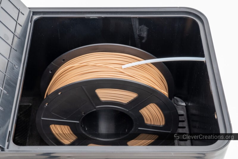 A roll of wood filament inside of the S4 filament dryer.