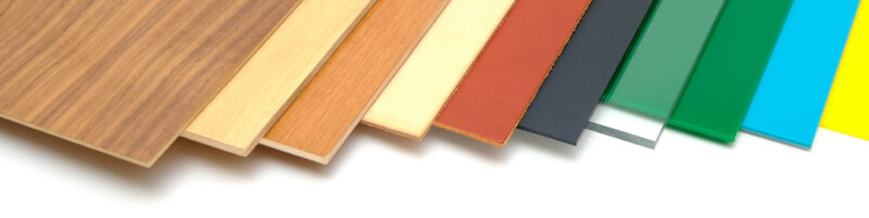 A range of material panels (wood, acrylic) laid out next to each other