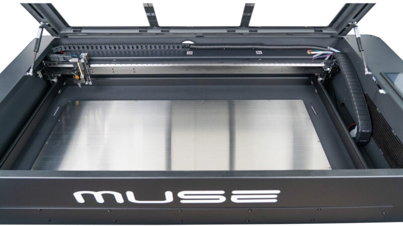 A Muse Titan laser machine with open lid.