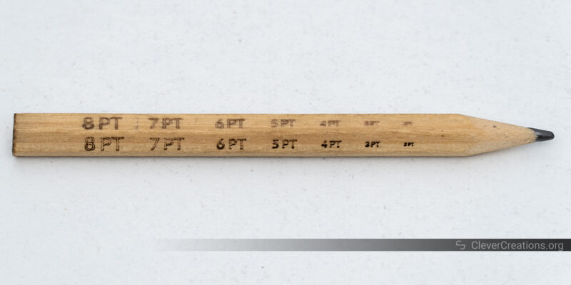 A small wooden pencil. The top area is engraved with the xTool S1, the bottom is scored.