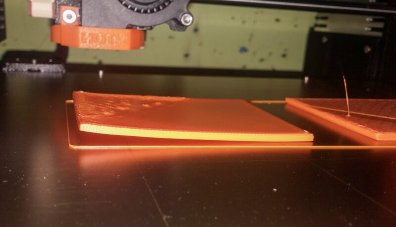 An ABS print warping and lifting caused by differences in temperature.