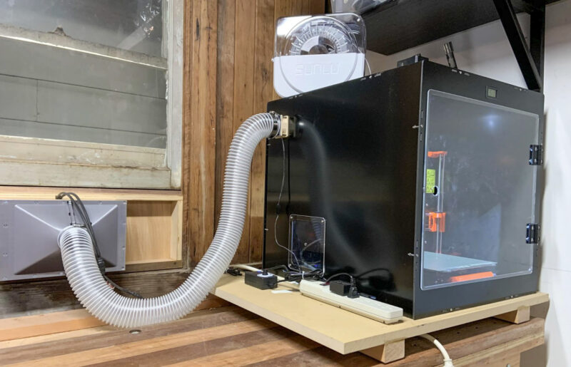 A 3D printer exclosure with ventilation to outside the building.