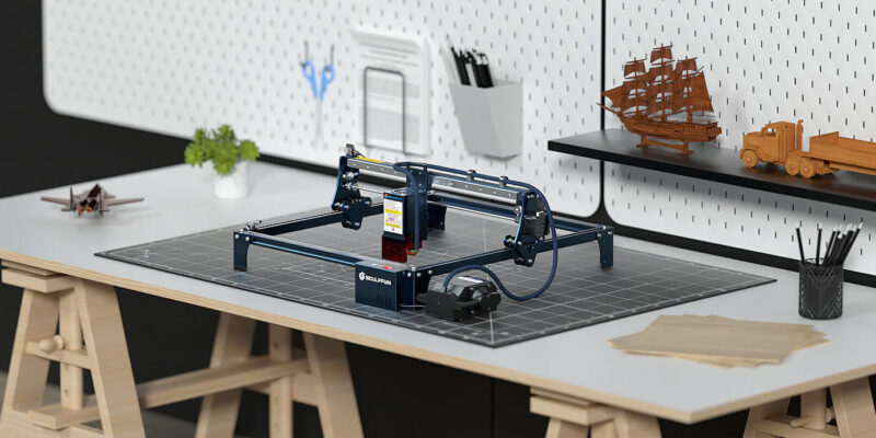 The Sculpfun S30 laser engraver and cutter on a workbench.