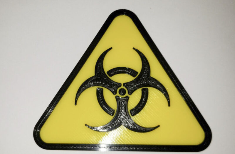 A 3D printed toxic warning sign in yellow and black ABS filament.