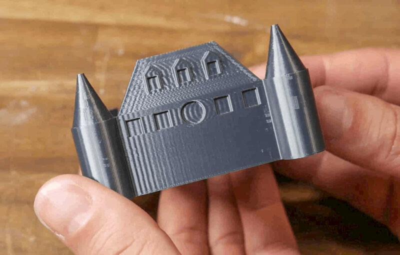 A 3D print of a castle showing ghosting/ringing caused by printing without resonance compensation.