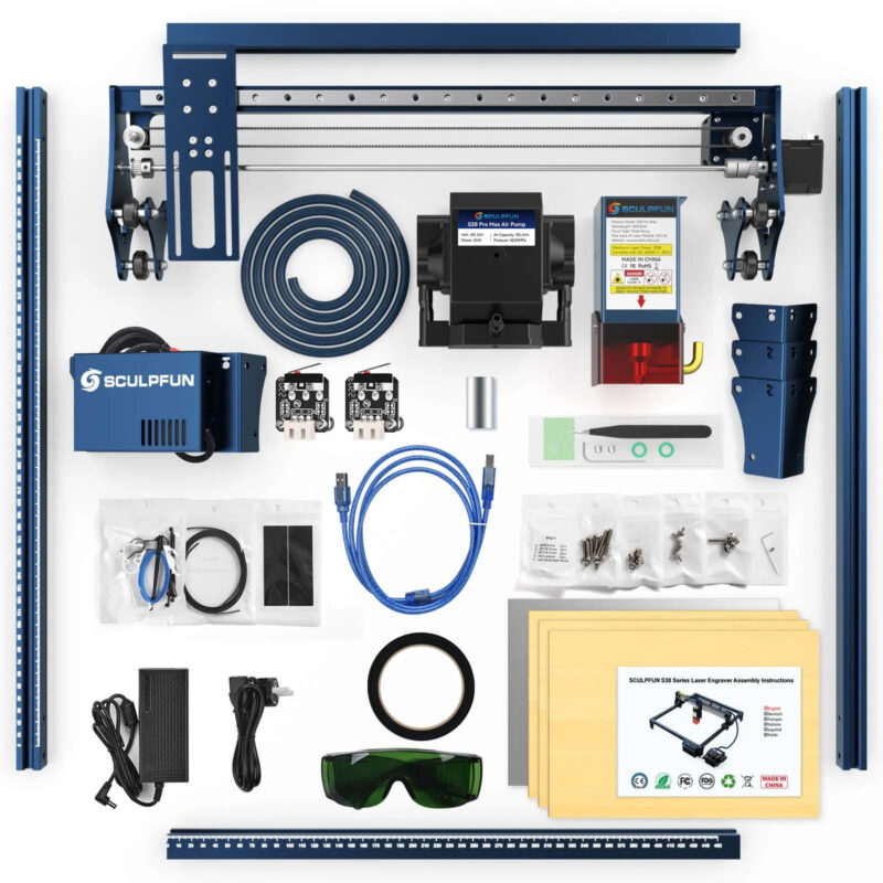 Top view of a variety of laser engraver components and accessories on a white surface.