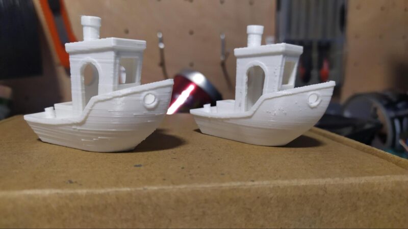 Two white 3D-printed 3Dbenchies with different surface finishes.