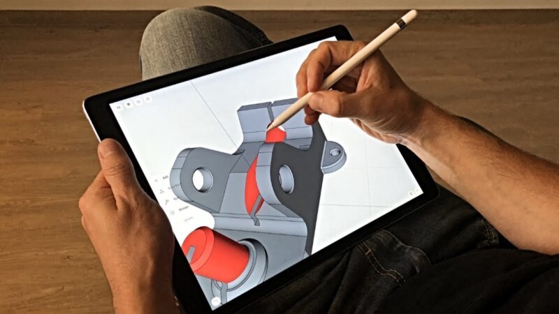 A person designing in CAD software on an iPad before slicing.