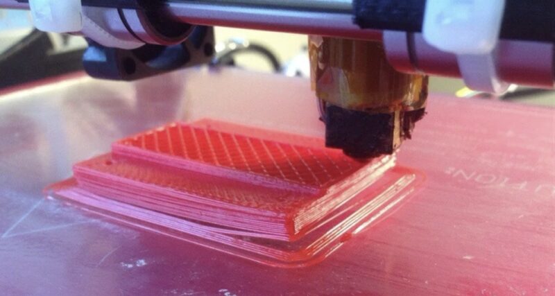A warping ABS print in a 3D printer.