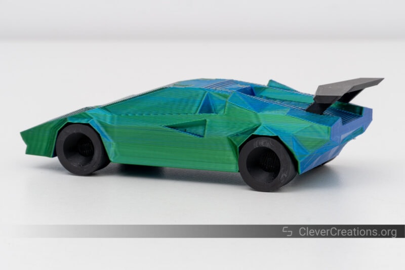 A 3D printed Lamborghini Countach in green, blue, and black PLA.
