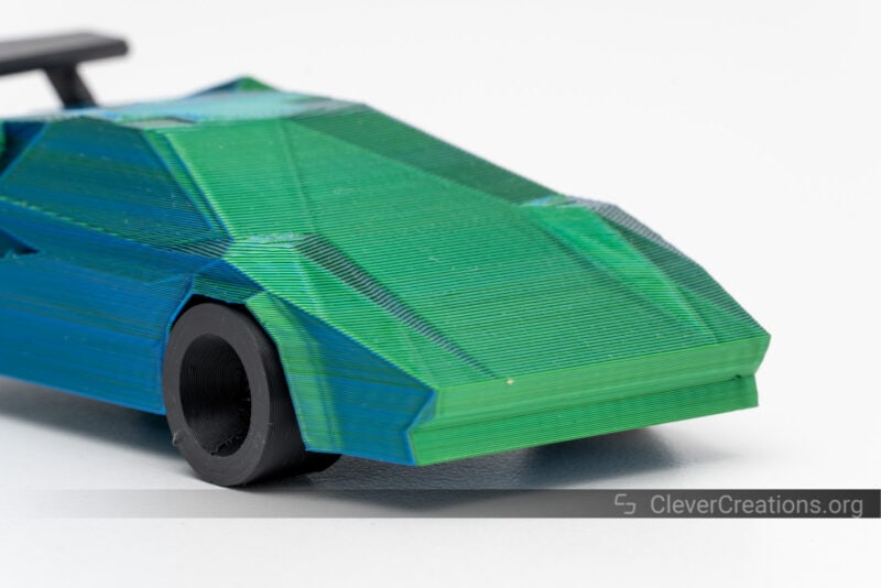 A 3D printed Lamborghini Countach in green, blue, and black PLA.