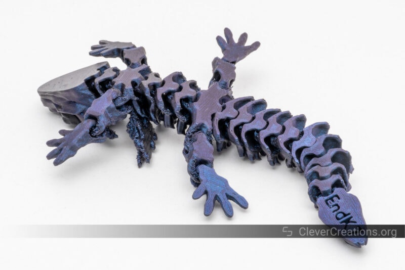 A 3D printed Glorious Baby Dragon in purple/blue PLA.