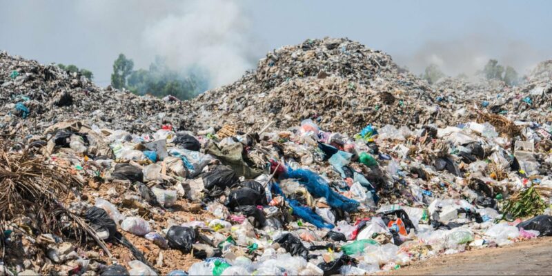A landfill with non-recycled ABS filament and other plastic materials on a big pile.