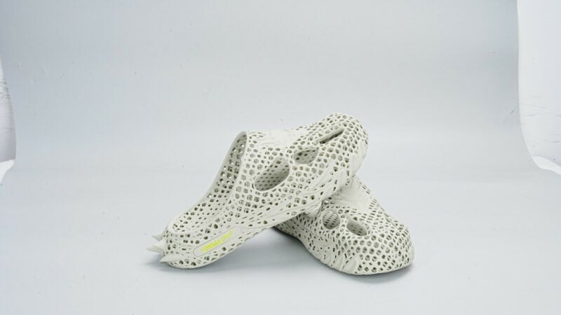 A pair of white 3D printed shoes.