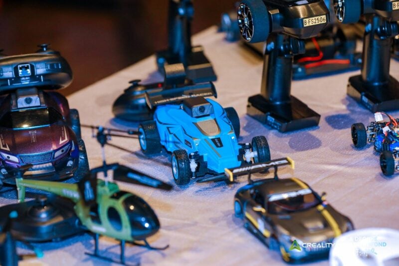 A collection of 3D printed RC vehicles and helicopters.