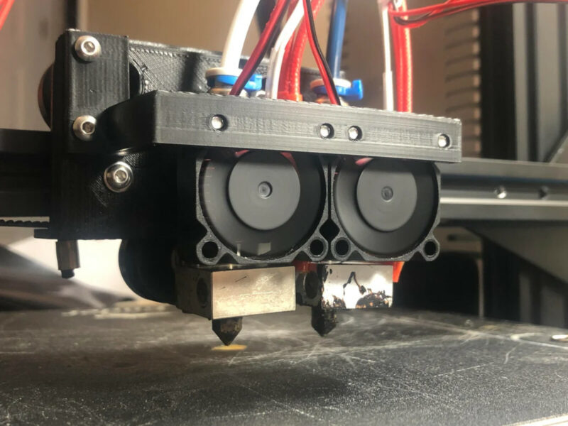 A dual extruder printer with side-by-side nozzles.