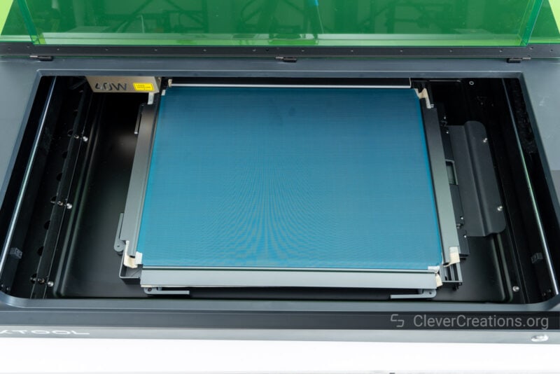 A mesh screen with frame placed in the xTool S1 laser cutter.