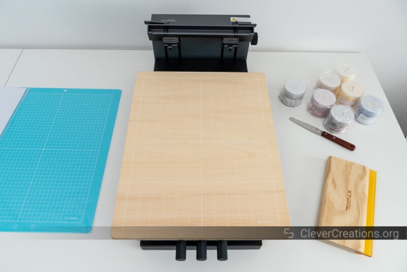 The wooden magnetic board placed on the xTool Screen Printer.