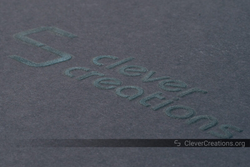 The 'Clever Creations' logo screen printed in multiple layers of glow-in-the-dark paint.
