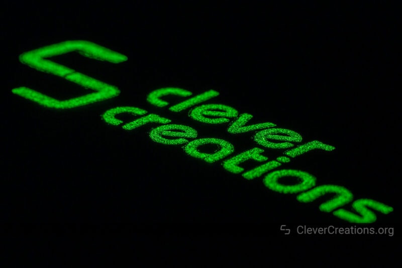 The 'Clever Creations' logo glowing in the dark.