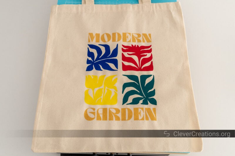 A tote bag with a colorful print on it.